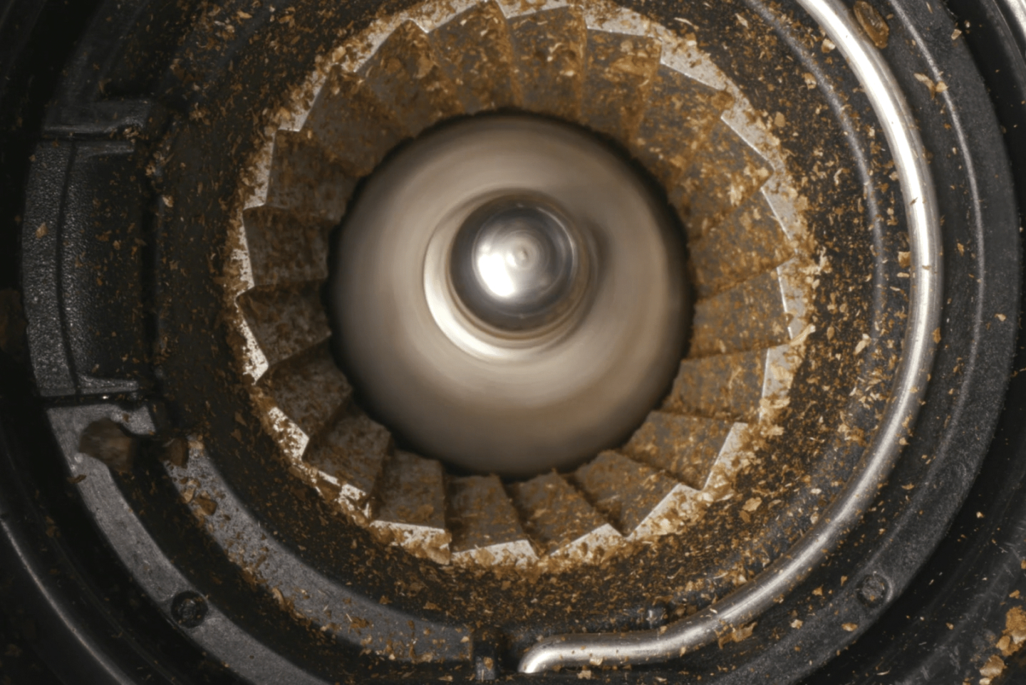 Close-up of a burr coffee grinder